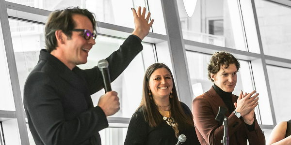 3 employees celebrating at awards banquet