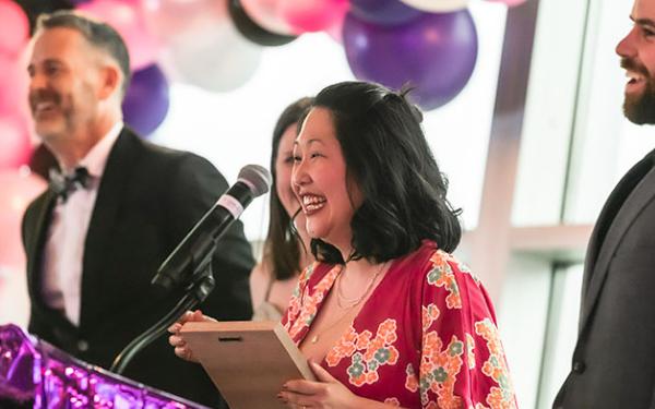 woman holding award at Barefies Award Ceremony