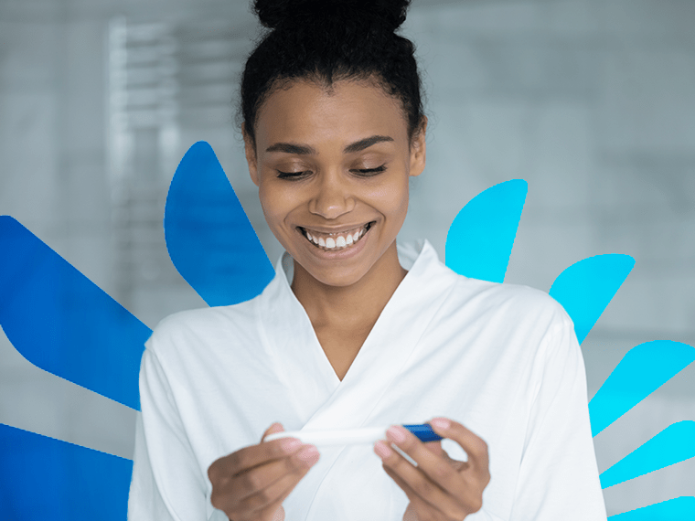 Clearblue logo with black woman holding pregnancy test