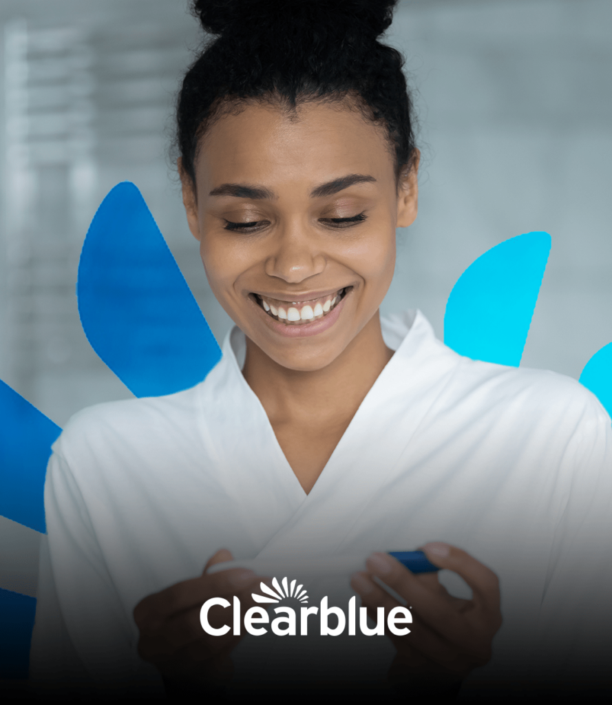 Clearblue logo with black woman holding pregnancy test