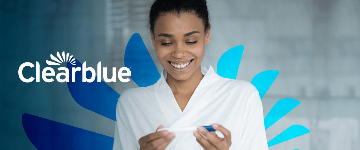 Clearblue logo with black woman holding pregnancy test
